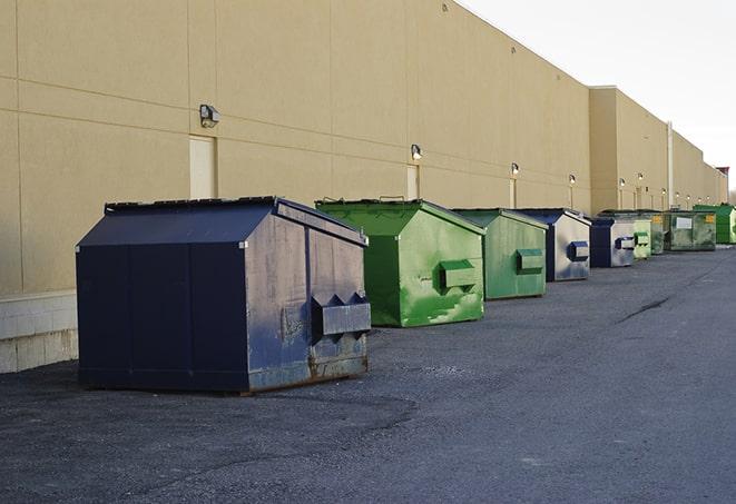 a site supervisor checking a construction dumpster in Perry